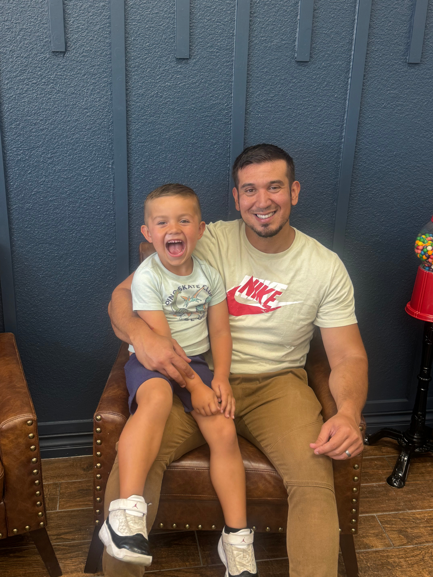 Father and son at the shop